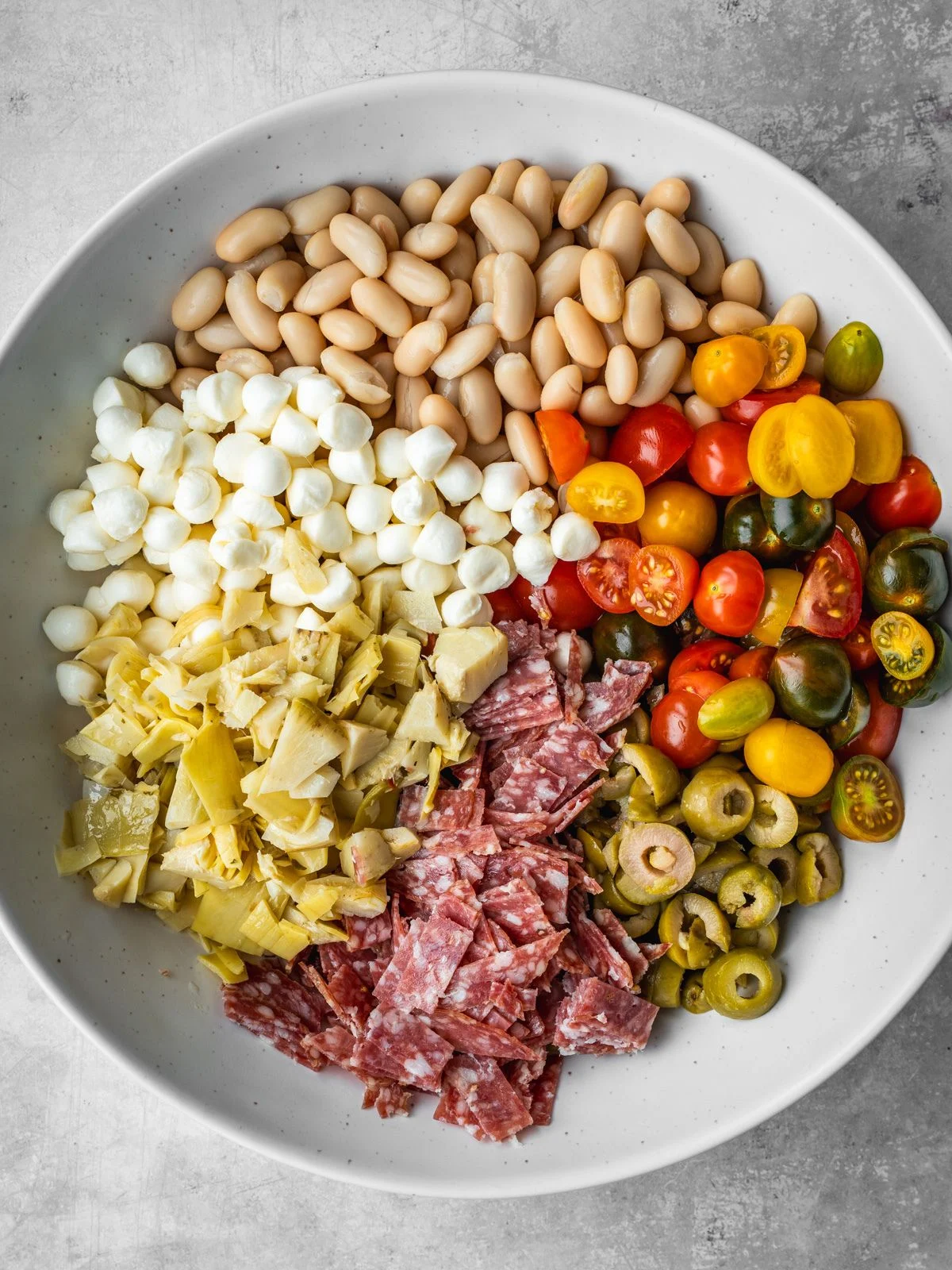 Antipasto salami dense bean salad in a bowl