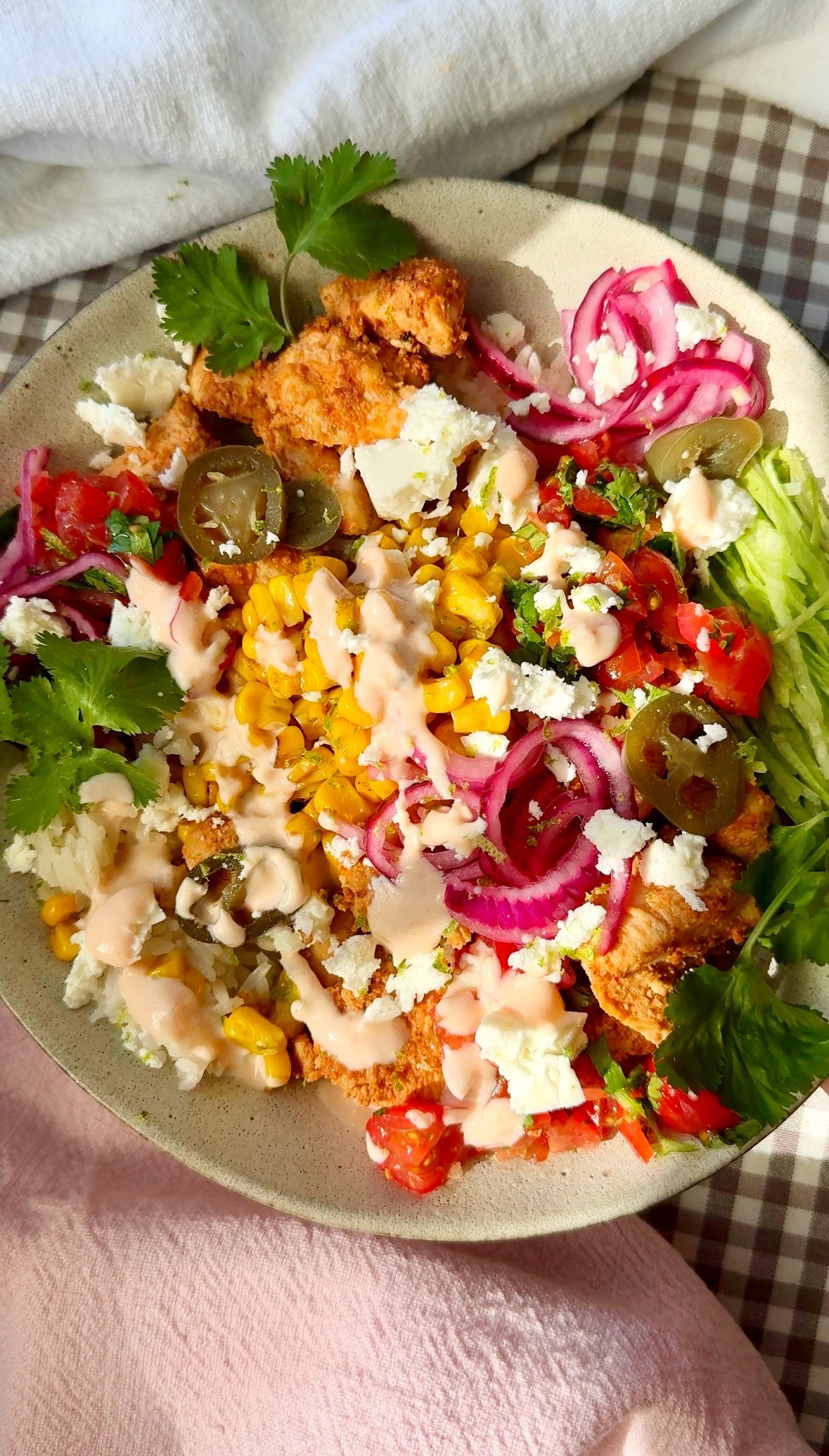 Bang bang chicken bowl with rice, corn, chicken, and sauce