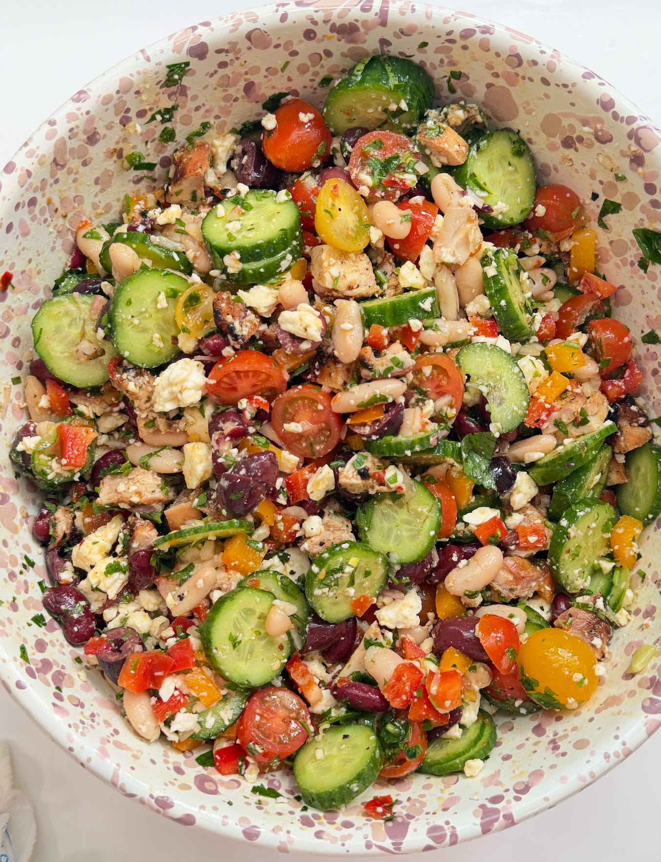 Calabrian chili chicken dense bean salad in a bowl