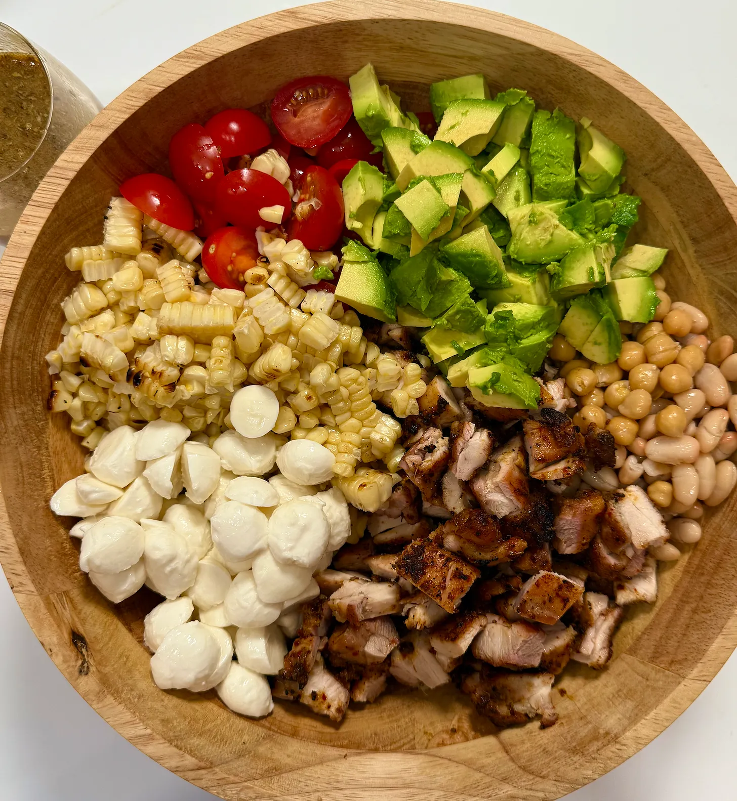 Chicken caprese dense bean salad in a bowl