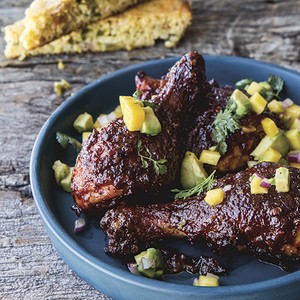 Sticky glazed chicken topped with mango avocado salsa