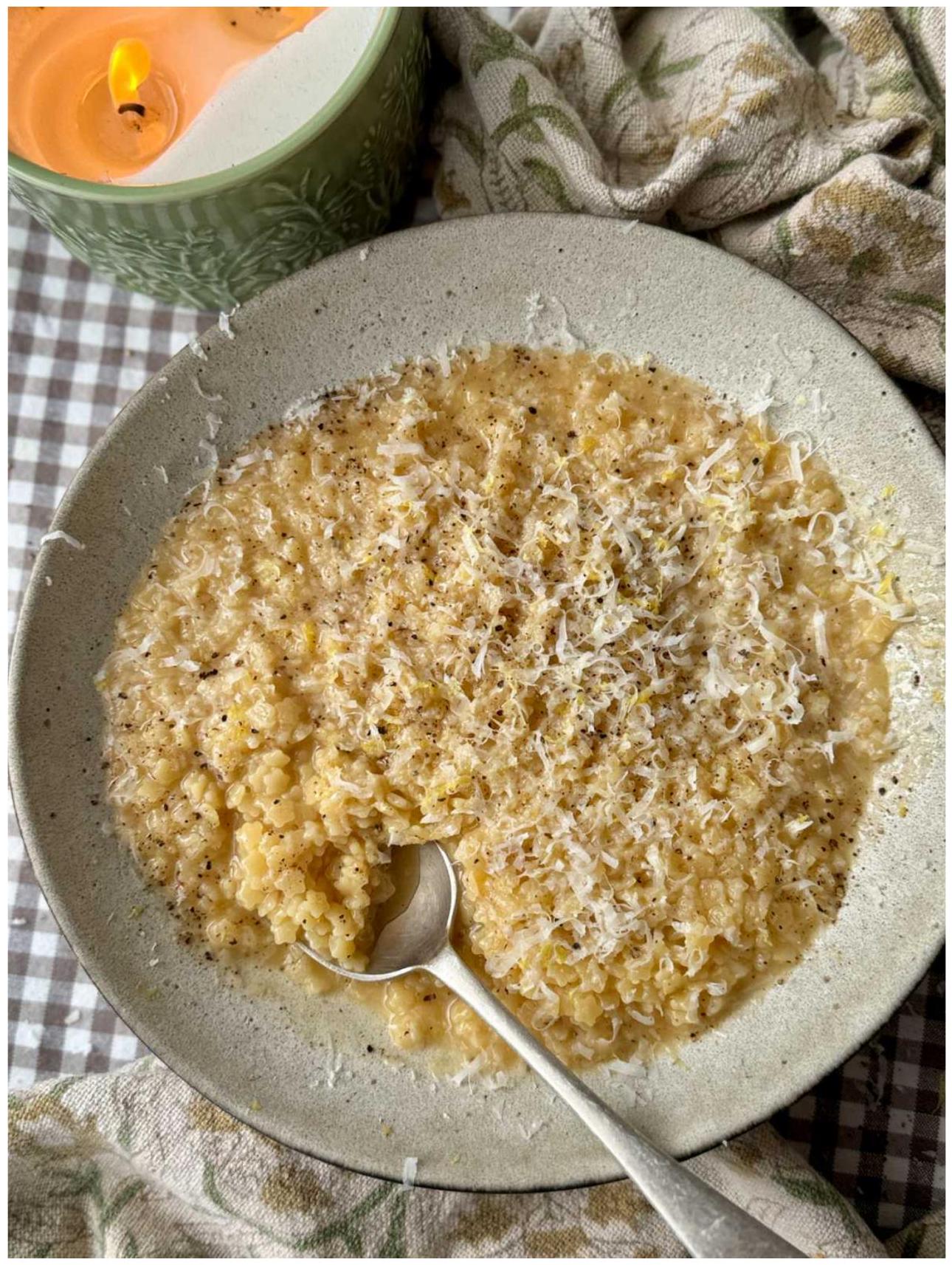 Creamy pastina in a bowl with black pepper