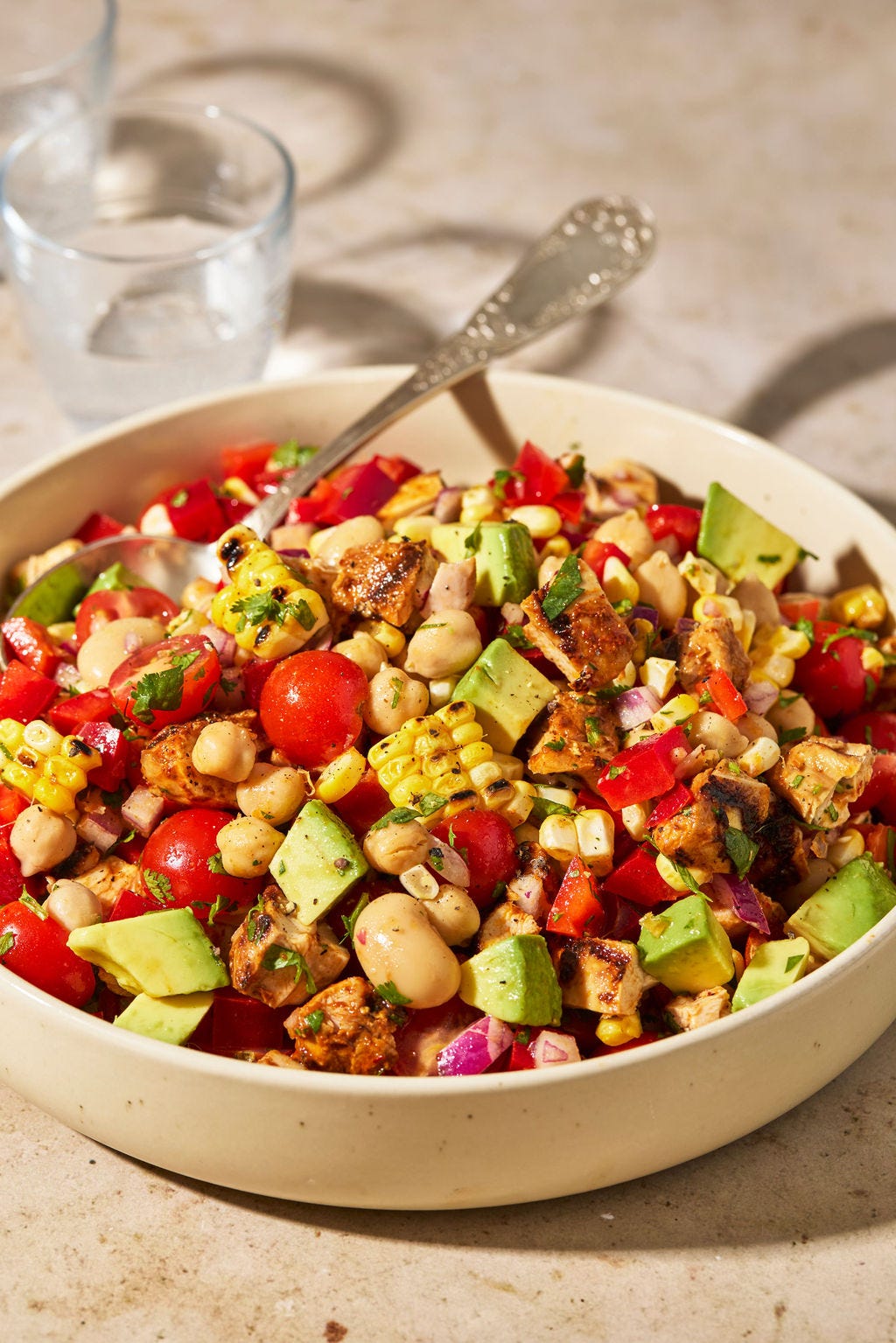 Grilled chipotle chicken and corn dense bean salad in a bowl