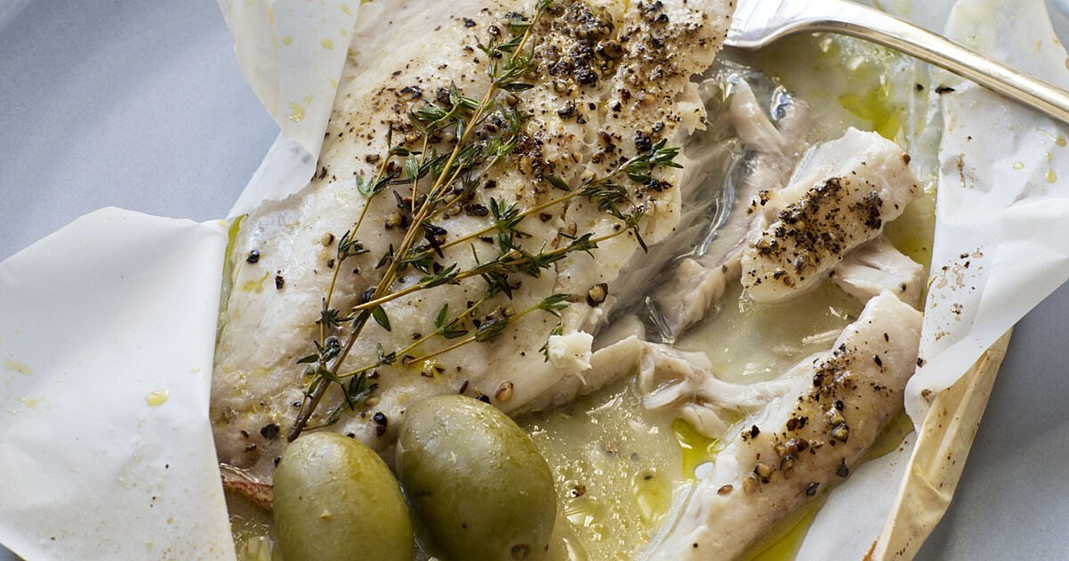 Herb-roasted fish in parchment with olives and thyme