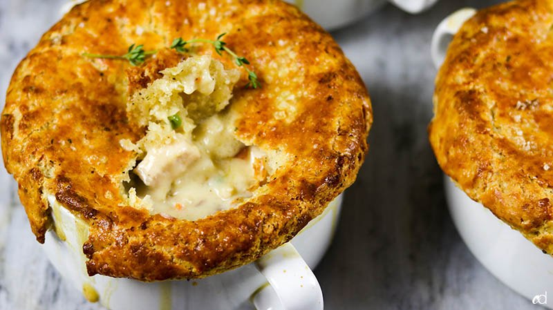 Mini leftover turkey pot pie baked in a mug with golden crust
