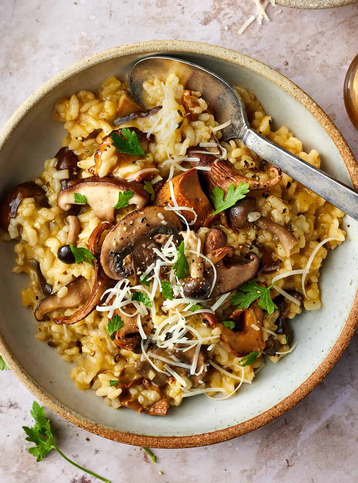Creamy mushroom risotto topped with herbs and mushrooms