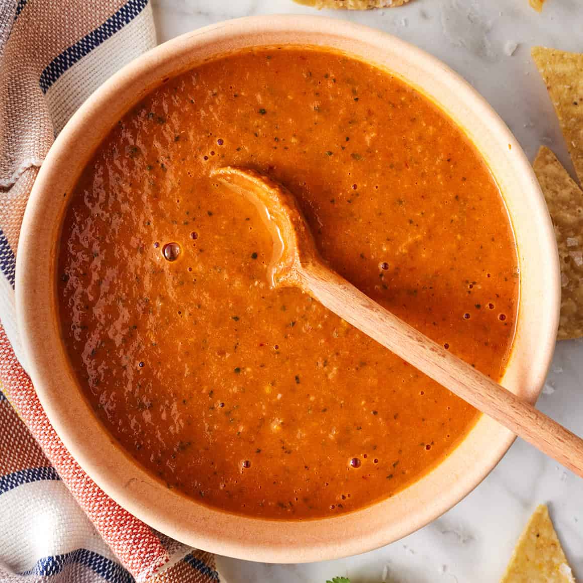 Bowl of ranchero sauce topped with cilantro