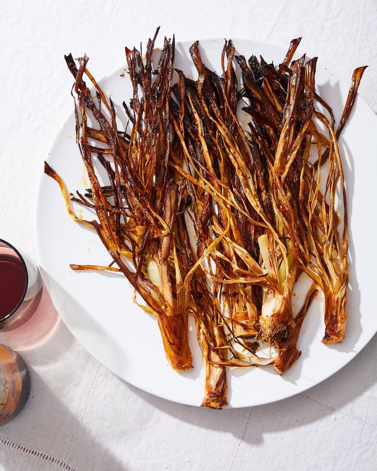 Spicy caramelized leeks roasted with harissa and lemon
