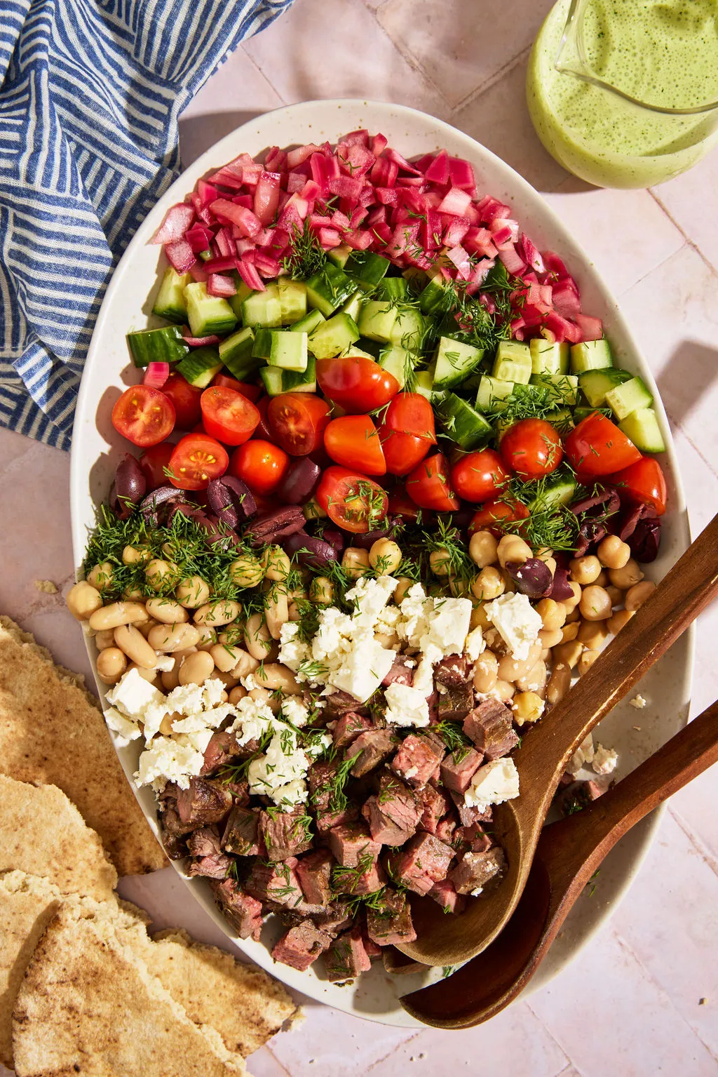 Steak tzatziki dense bean salad in a bowl
