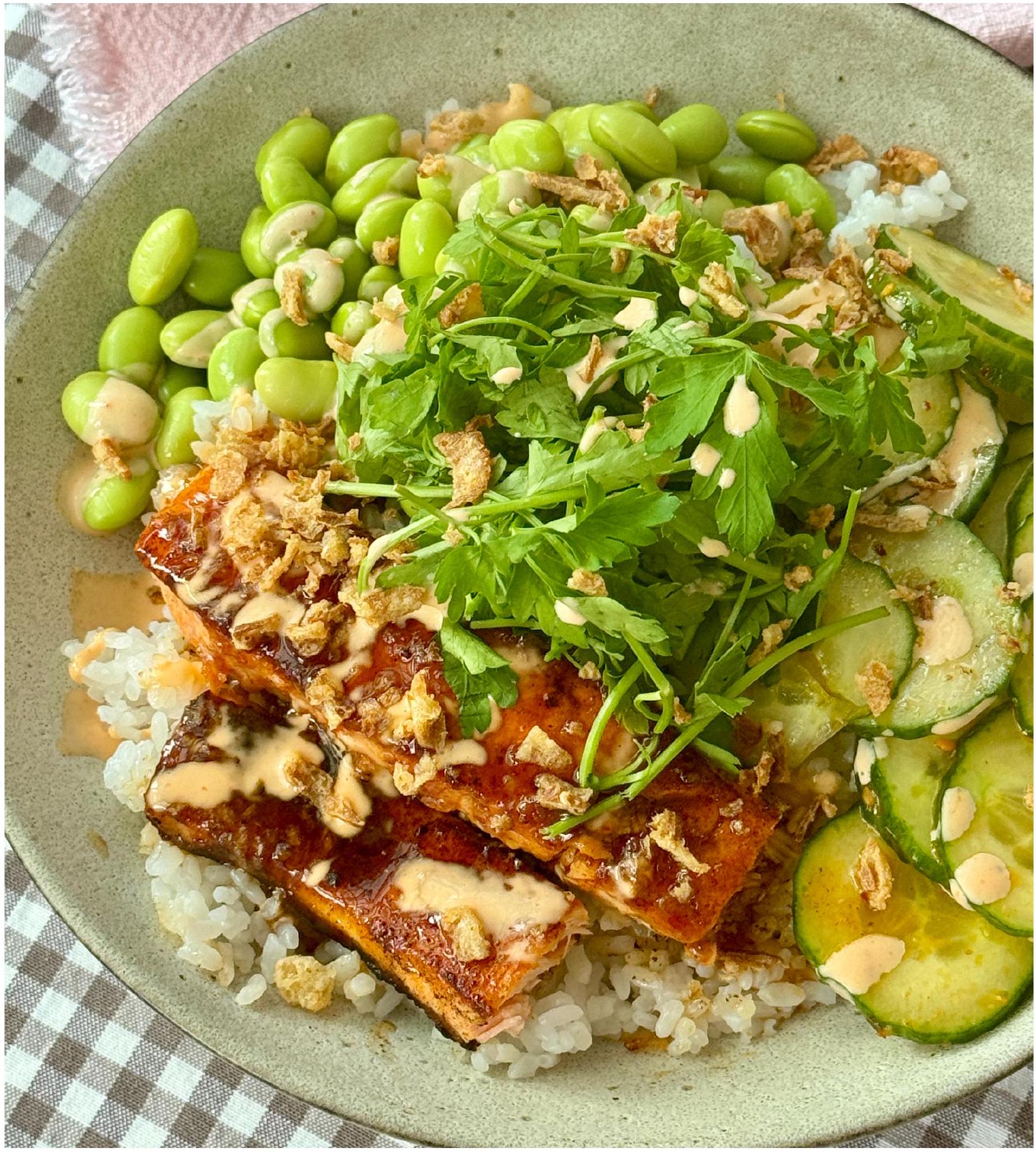 Sticky glazed salmon bowl with rice and cucumber salad